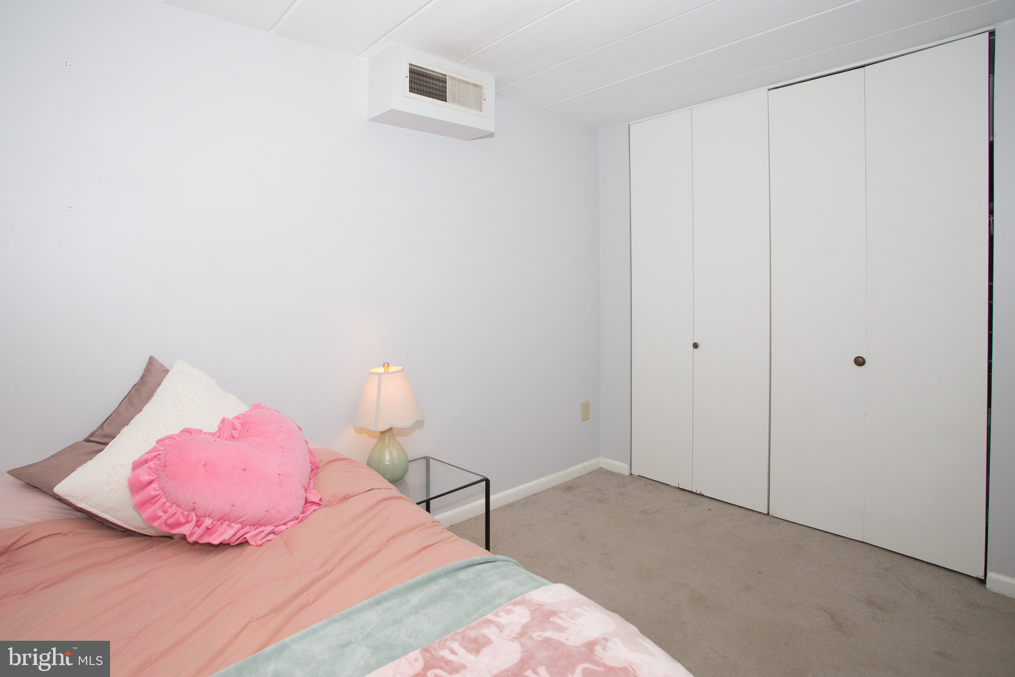 2304 Riddle Avenue, Unit 307 Wilmington, DE 19806 - Photo 17 of 23 a bedroom with a bed and a wall painting