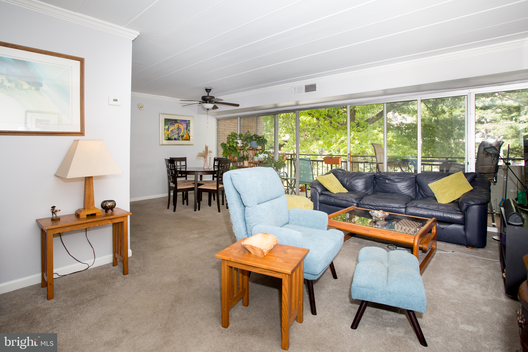 2304 Riddle Avenue, Unit 307 Wilmington, DE 19806 - Photo 7 of 23 a living room with furniture a table and a large window