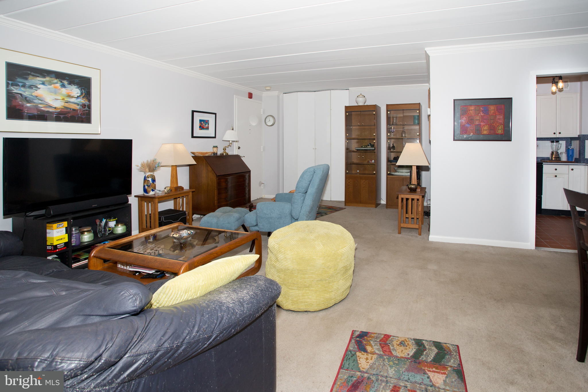2304 Riddle Avenue, Unit 307 Wilmington, DE 19806 - Photo 8 of 23 a living room with furniture and a flat screen tv