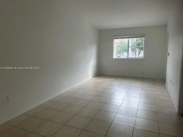 an empty room with a white cabinet door