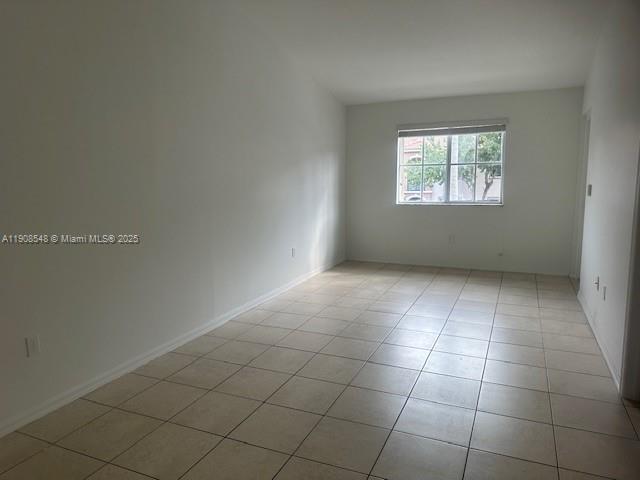 2920 Southeast 12th Road, Unit 20530 Homestead, FL 33035 - Photo 4 of 10 an empty room with a white cabinet door