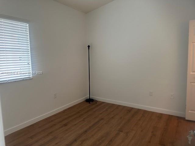 2920 Southeast 12th Road, Unit 20530 Homestead, FL 33035 - Photo 7 of 10 an empty room with wooden floor and windows