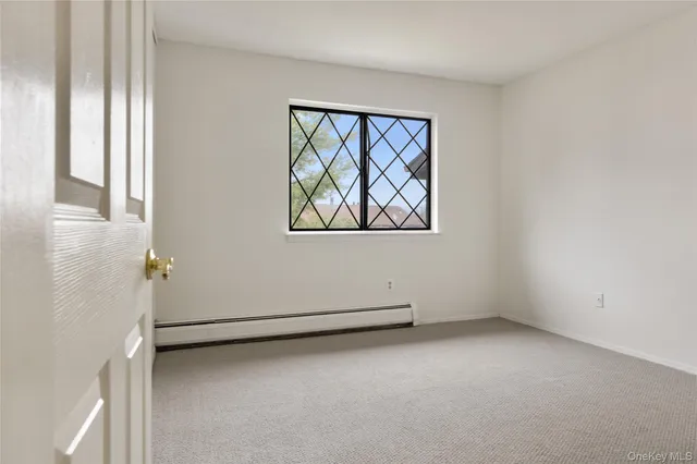 a view of closet with racks on the wall