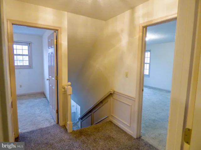 an empty room with closet area