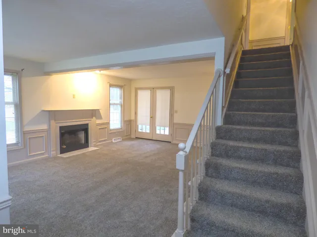 a kitchen with wooden cabinets and a sink