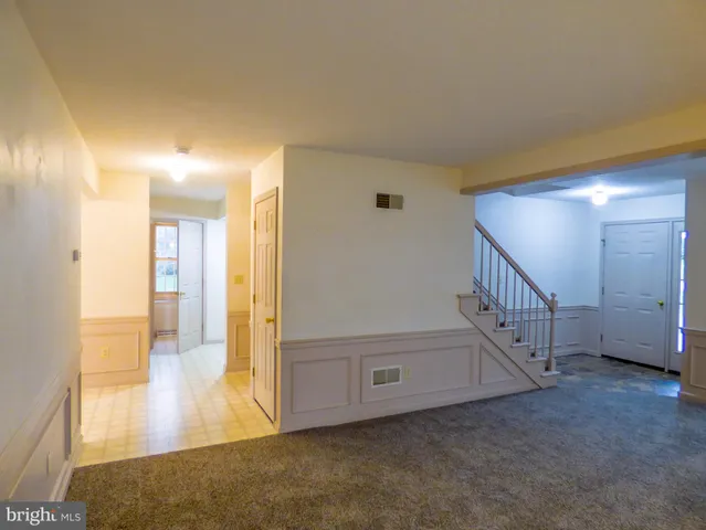 a kitchen with stainless steel appliances granite countertop a sink and a refrigerator