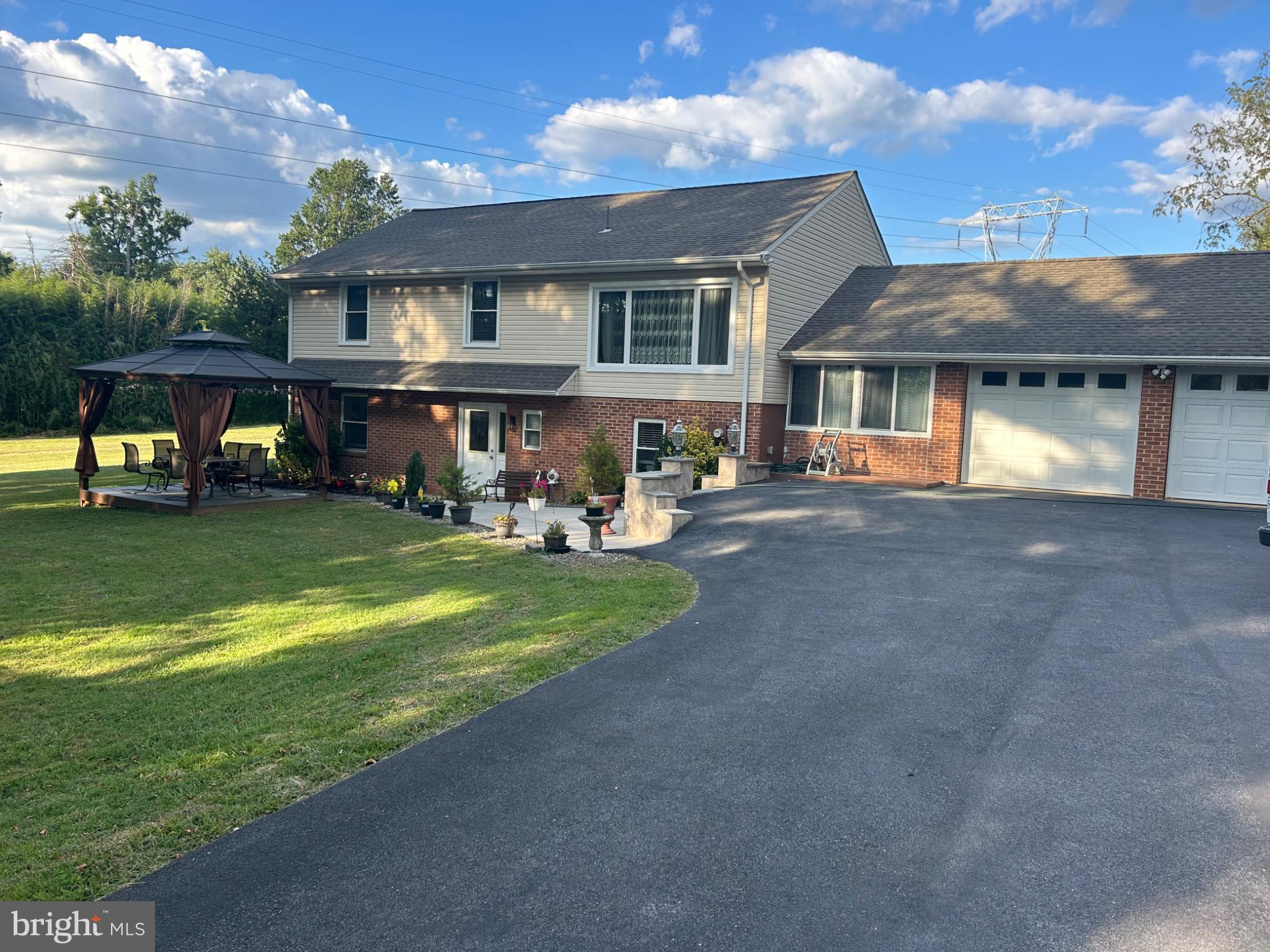 159 Planebrook Road Malvern, PA 19355 - Photo 1 of 30 a front view of a house with garden