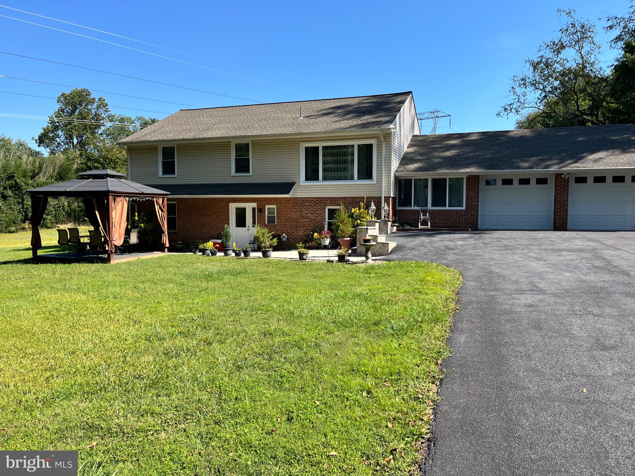 159 Planebrook Road Malvern, PA 19355 - Photo 2 of 30 a front view of a house with garden