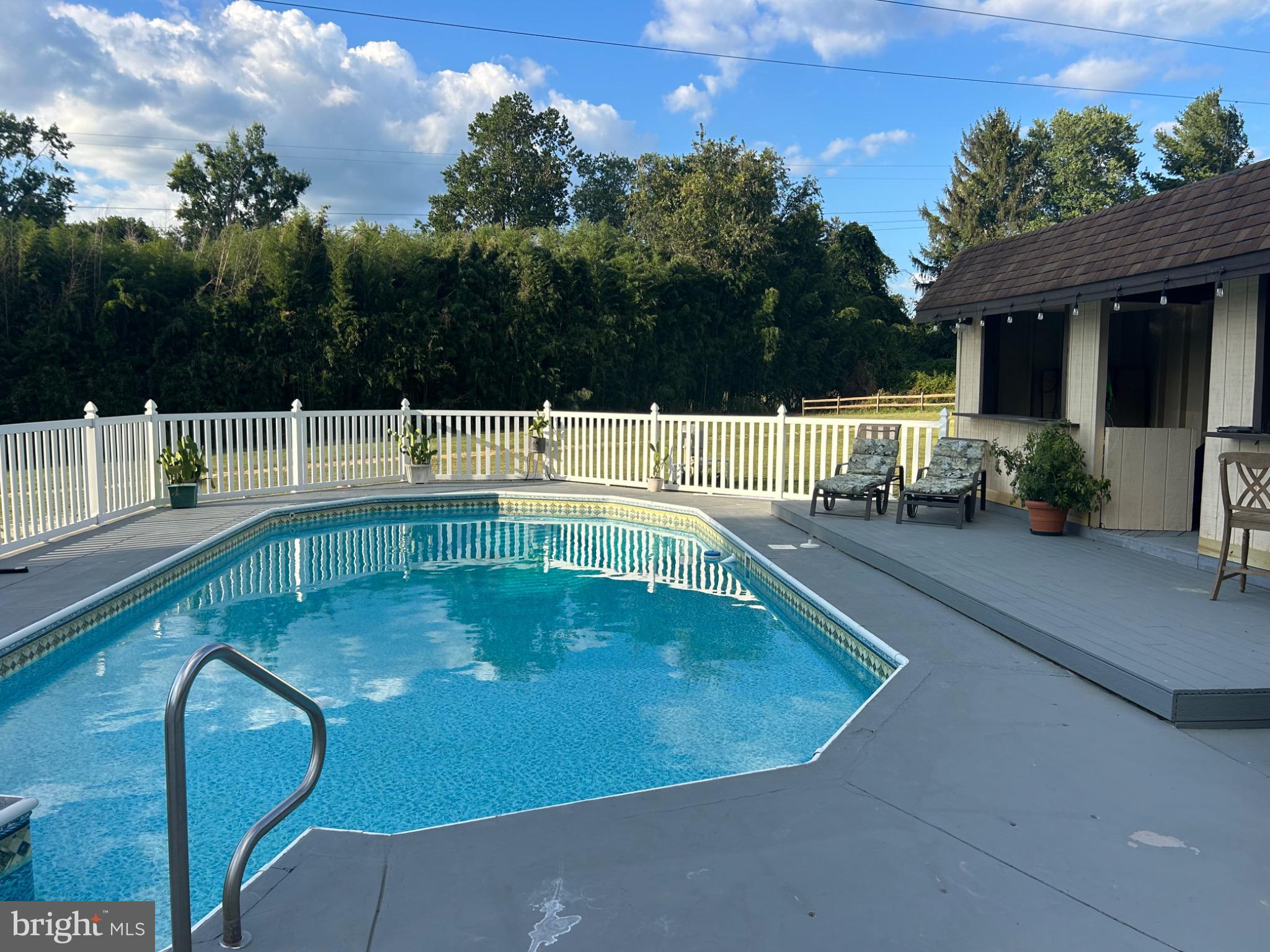 159 Planebrook Road Malvern, PA 19355 - Photo 8 of 30 a view of a swimming pool with a patio