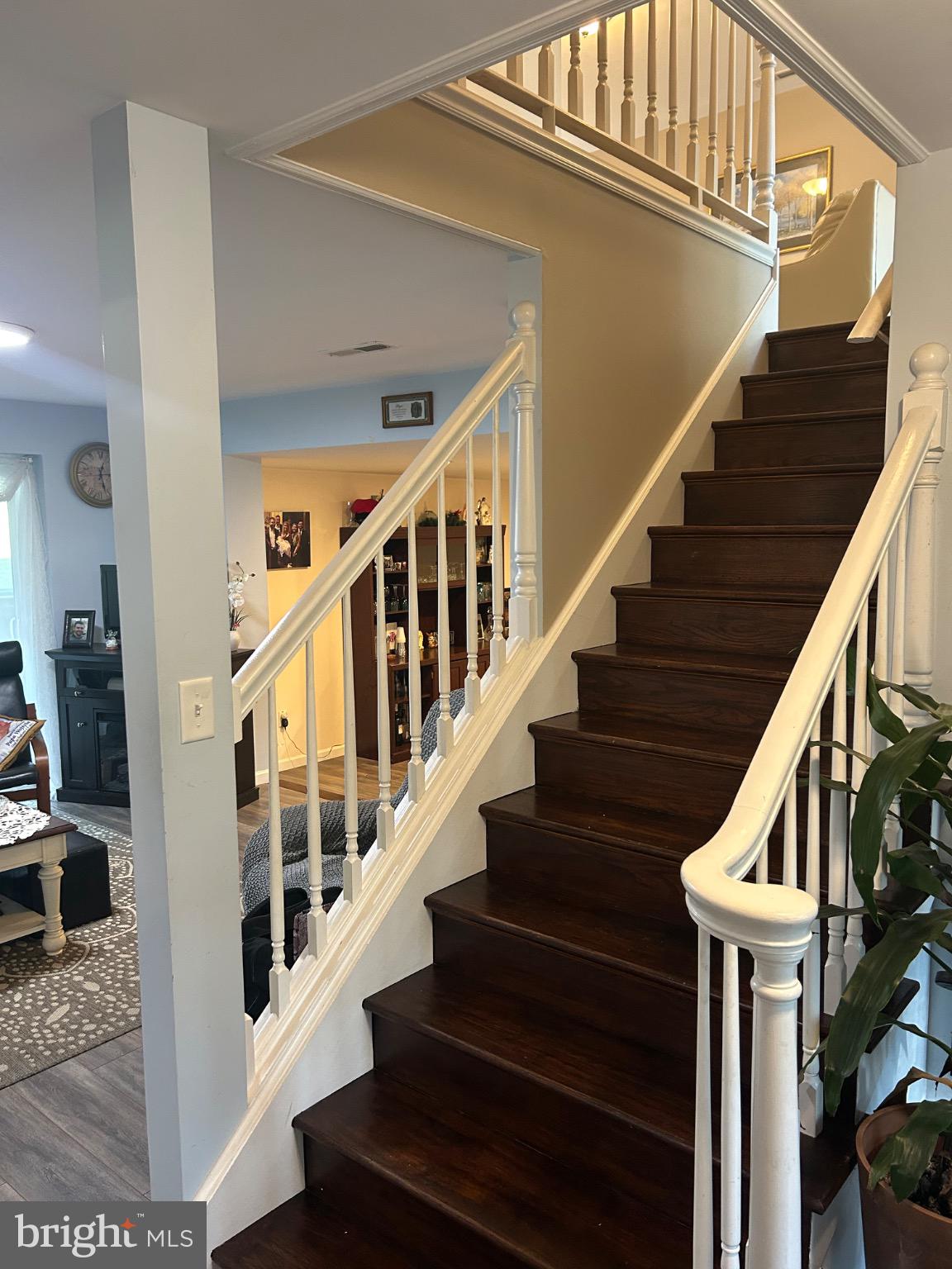 159 Planebrook Road Malvern, PA 19355 - Photo 10 of 30 a view of staircase with lots of frames on wall and windows