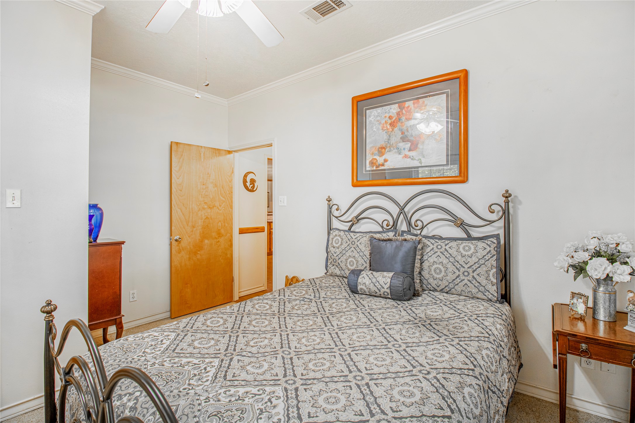 9310 South Business 6 Navasota, TX 77868 - Photo 24 of 48 a bedroom with a bed and a painting on the wall