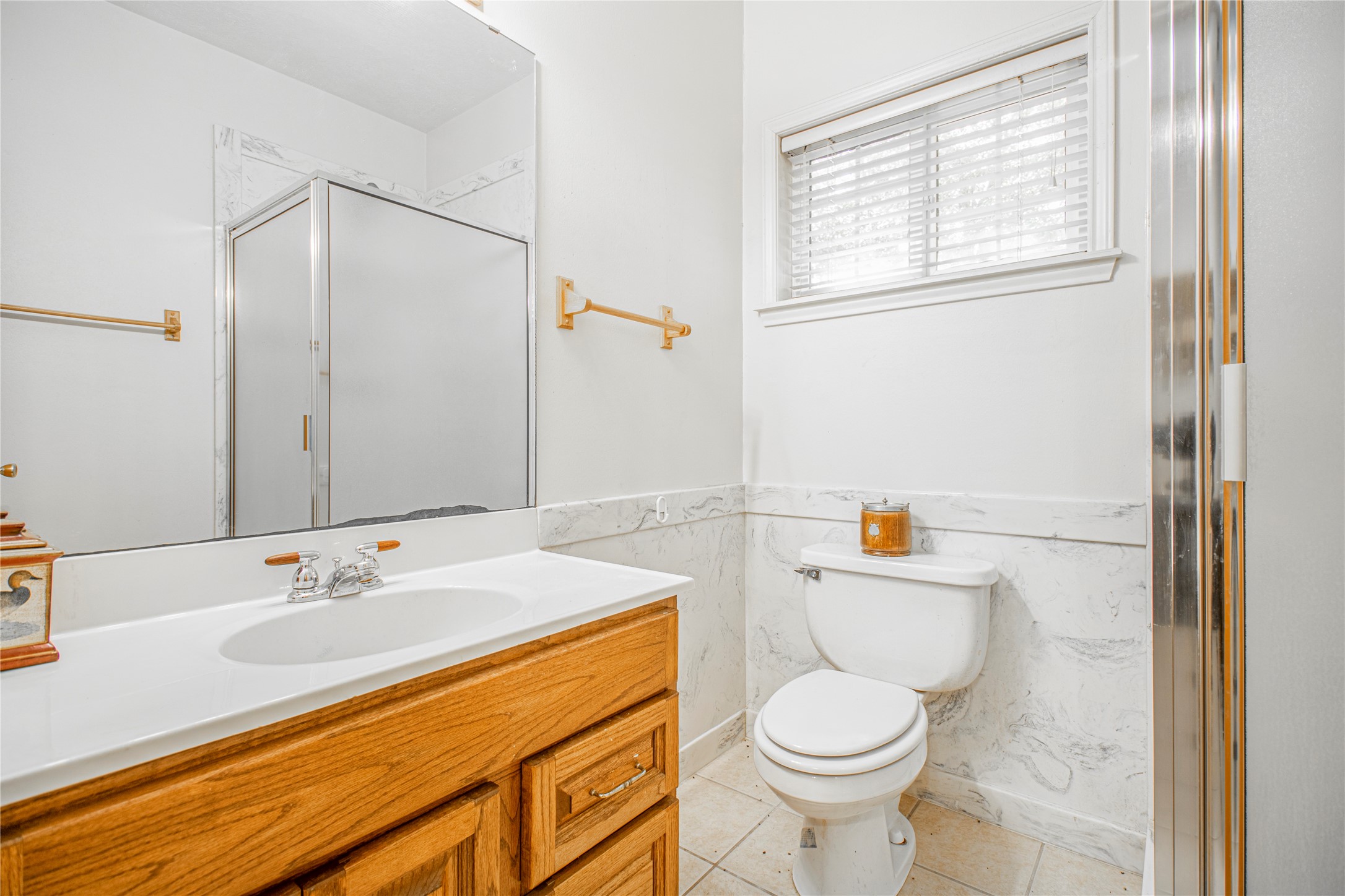 9310 South Business 6 Navasota, TX 77868 - Photo 35 of 48 a bathroom with a granite countertop sink toilet and shower