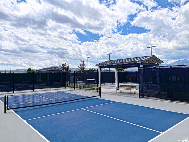 11508 Kitty Hawk Road South Jordan, UT 84009 - Photo 34 of 38 Dedicated pickleball courts featuring blue playing surfaces with white boundary lines