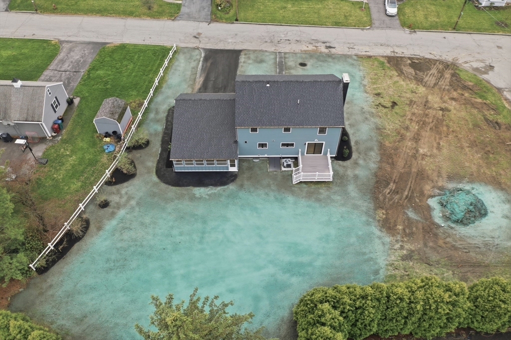 105 Stafford Road Lowell, MA 01852 - Photo 33 of 42 an aerial view of a house with a garden