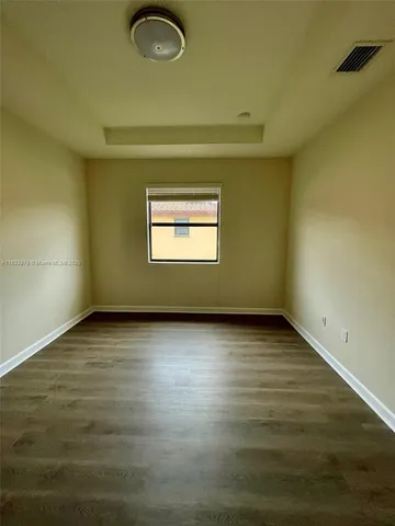 a spacious bathroom with a double vanity sink mirror and toilet