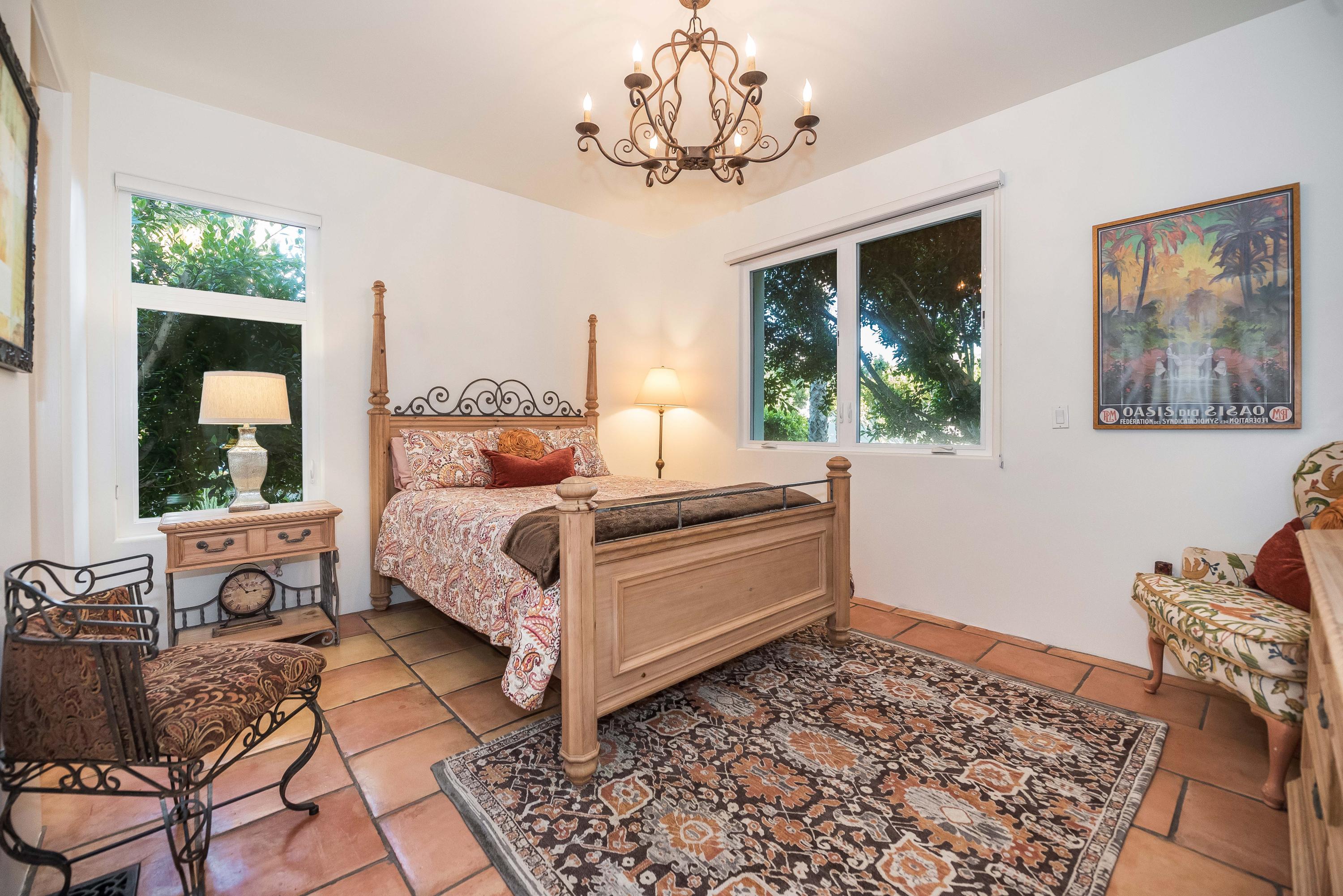 875 Sand Point Road Carpinteria, CA 93013 - Photo 19 of 25 a bedroom with a large bed and a window