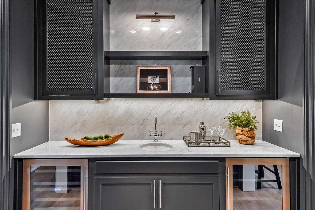 258 Pineland Road Northwest Atlanta, GA 30342 - Photo 11 of 87 a sink with a stove and wooden floor
