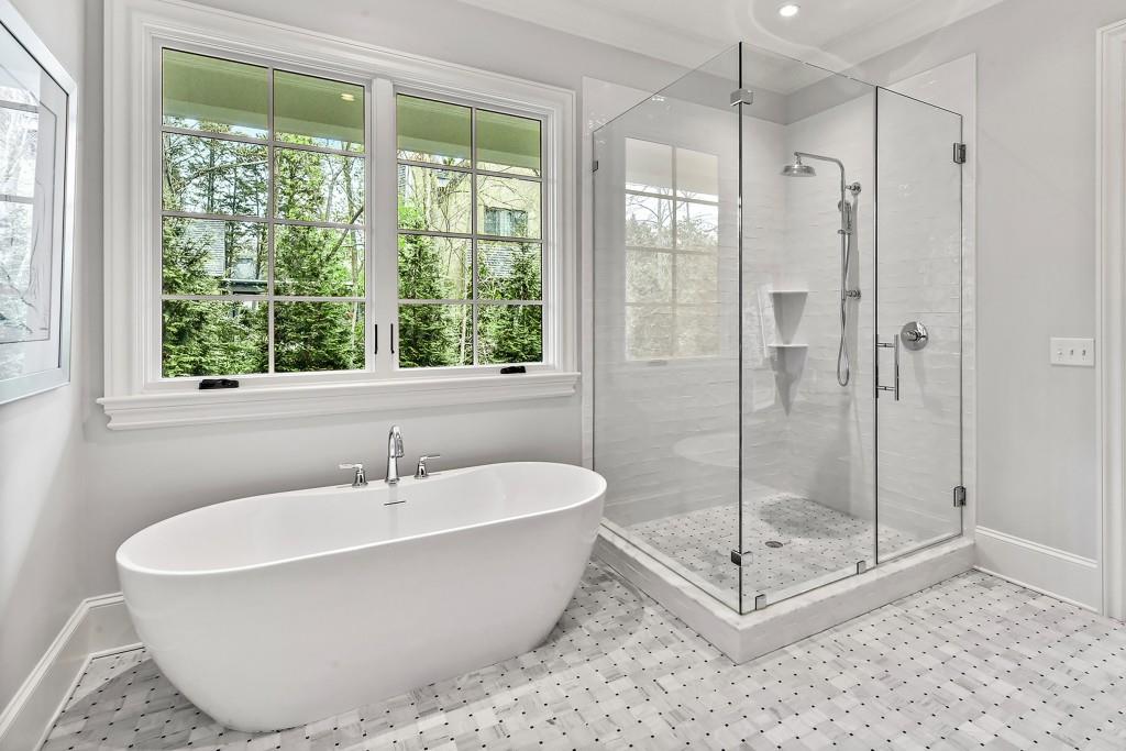 258 Pineland Road Northwest Atlanta, GA 30342 - Photo 40 of 87 a white bath tub sitting next to a window