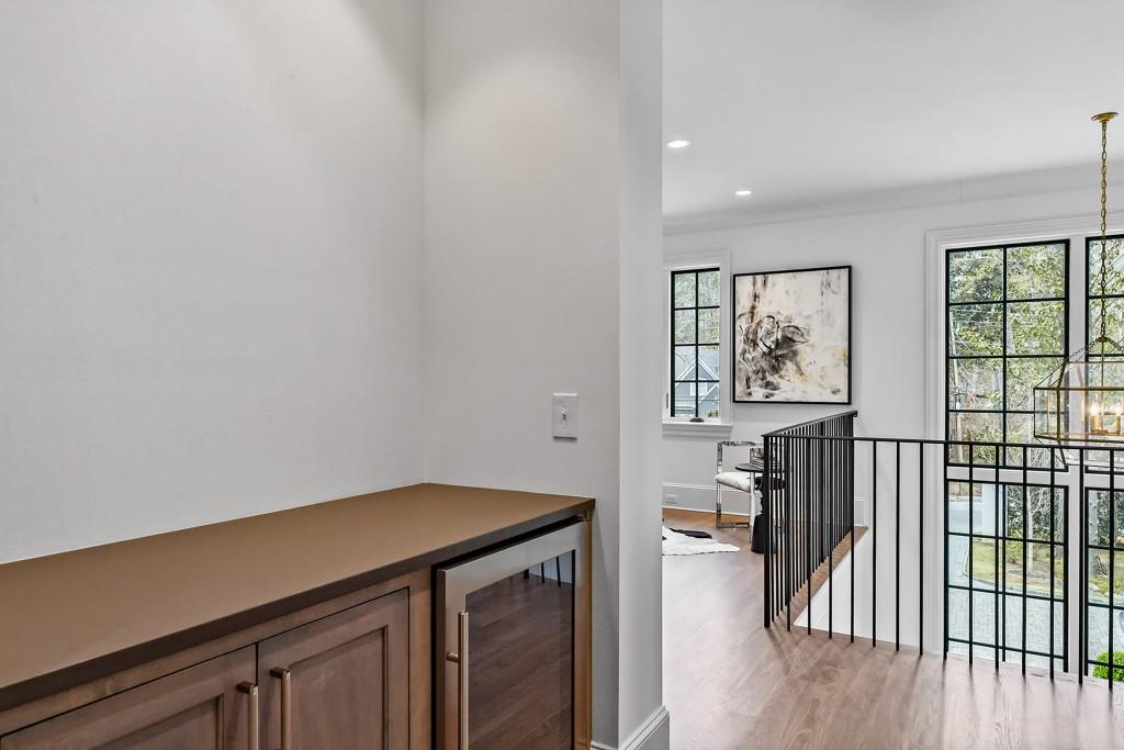 258 Pineland Road Northwest Atlanta, GA 30342 - Photo 45 of 87 a view of a hallway with wooden floor and a window