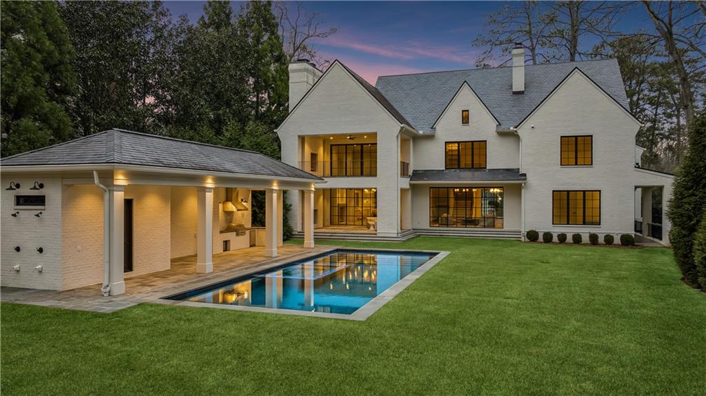 258 Pineland Road Northwest Atlanta, GA 30342 - Photo 69 of 87 a front view of a house with a yard