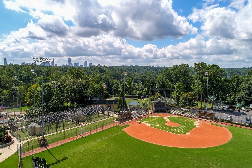 258 Pineland Road Northwest Atlanta, GA 30342 - Photo 85 of 87 a view of a swimming pool with a yard and a fountain