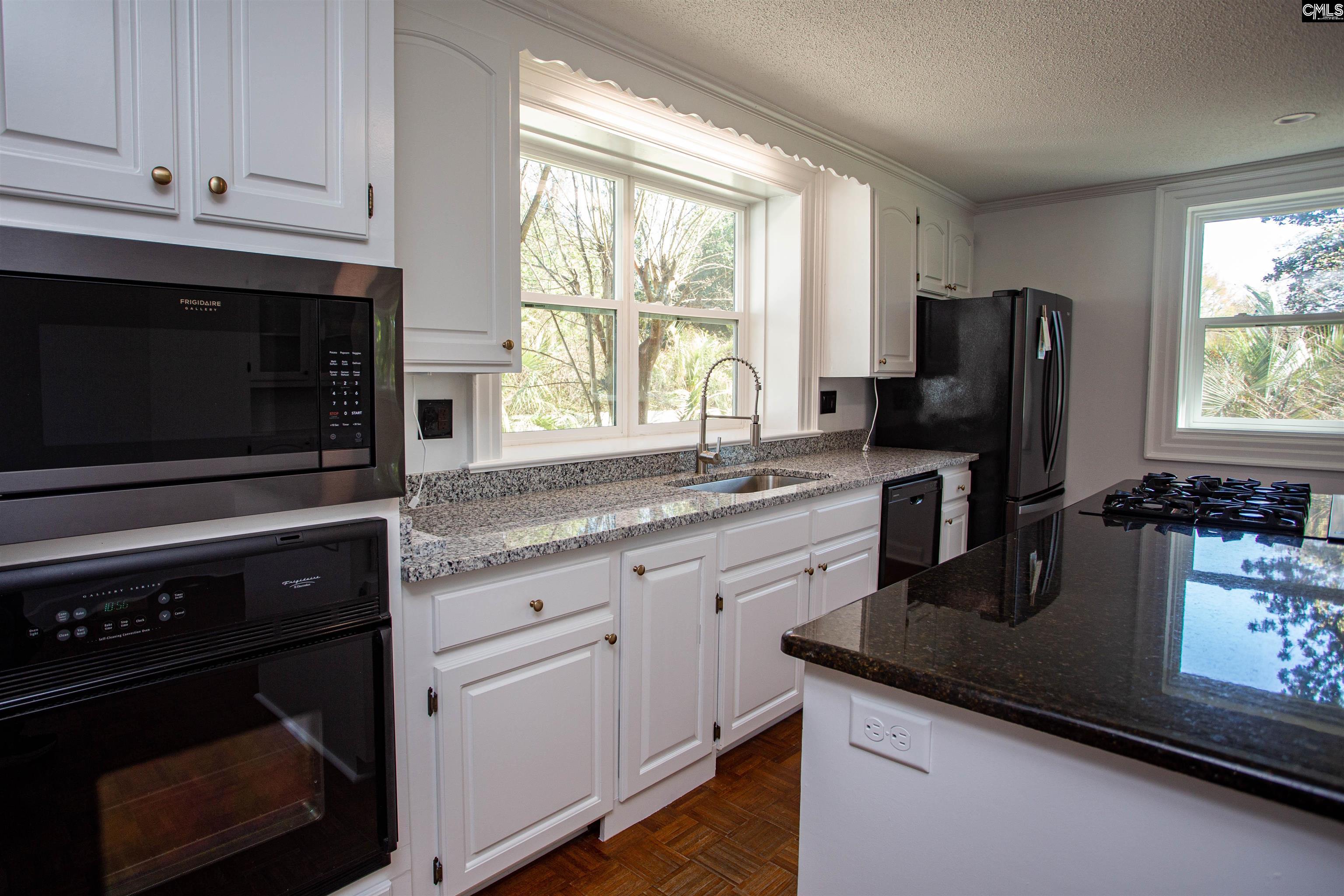 1700 Broad Street Camden, SC 29020 - Photo 8 of 41 a kitchen with granite countertop a stove sink and microwave