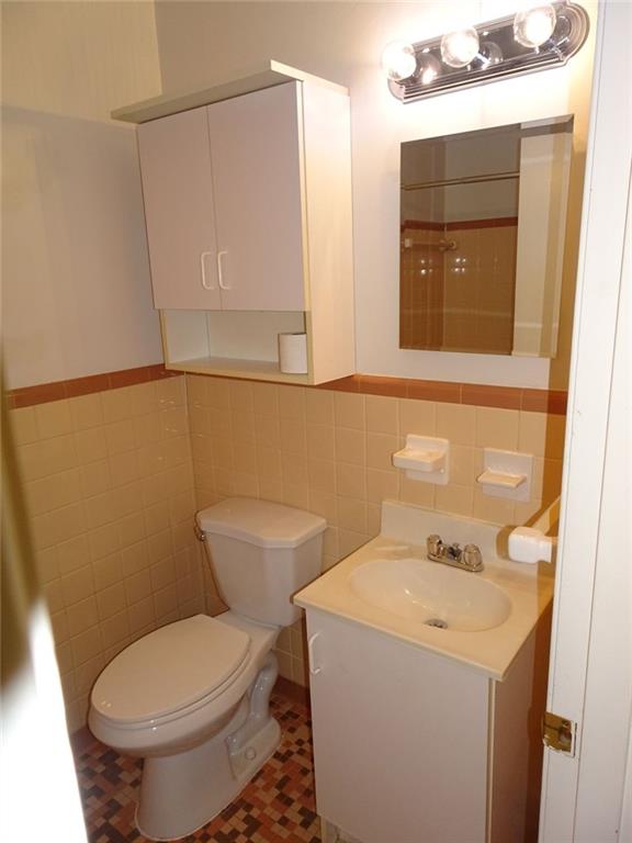 283 Lake Drive Atlanta, GA 30340 - Photo 8 of 14 a bathroom with a toilet sink and mirror