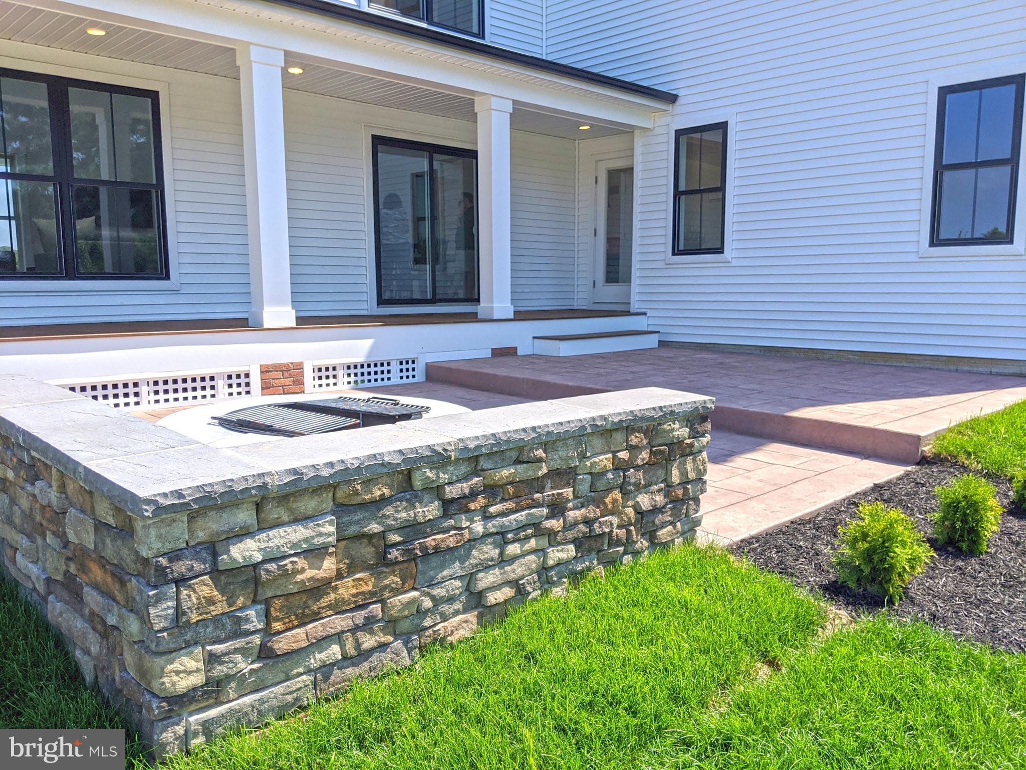 16448 Four Leaf Drive Lewes, DE 19958 - Photo 25 of 45 Rear Stamped Concrete Patio