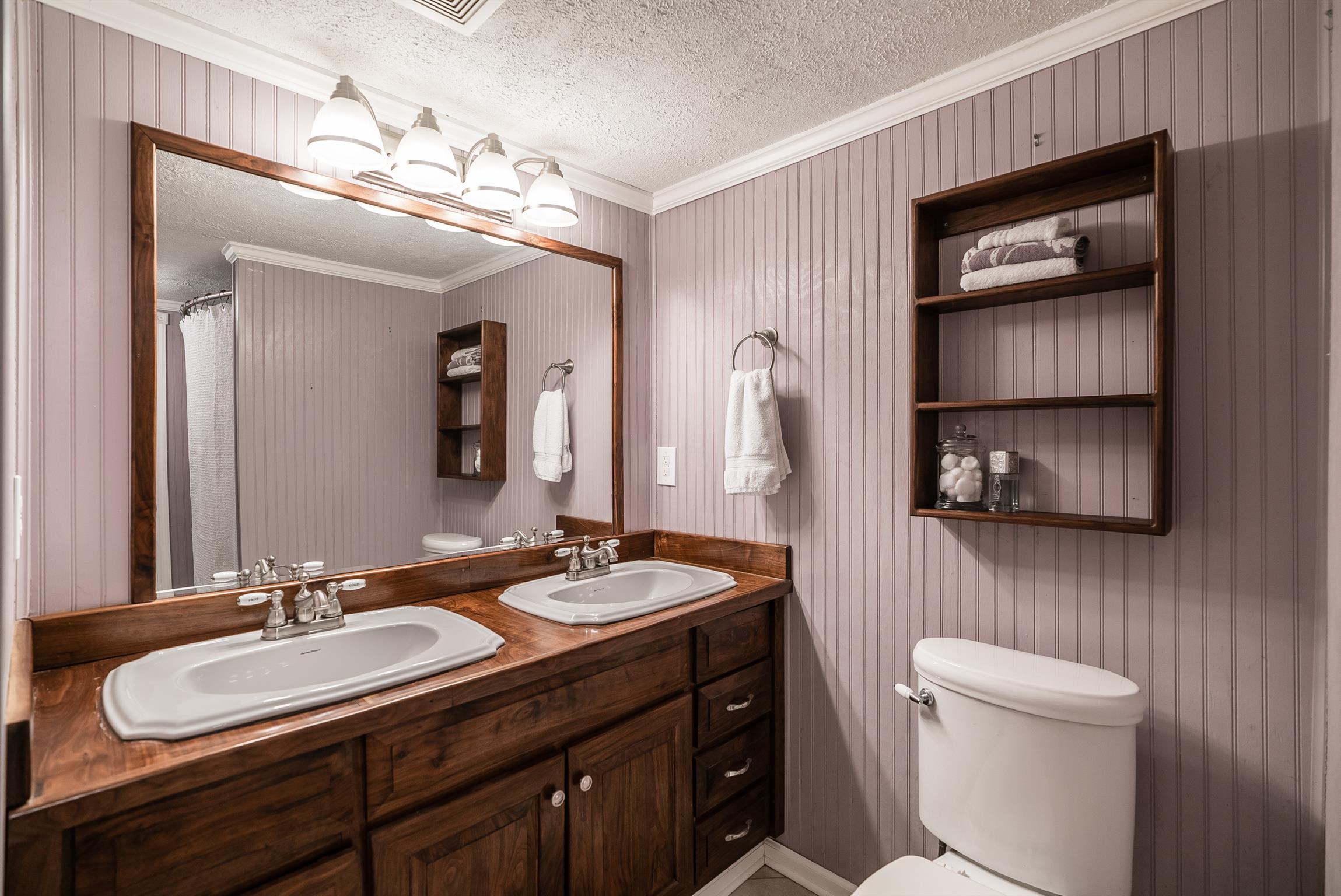 88 Canoe Branch Road Lebanon, TN 37087 - Photo 15 of 30 a bathroom with a double vanity sink and a mirror