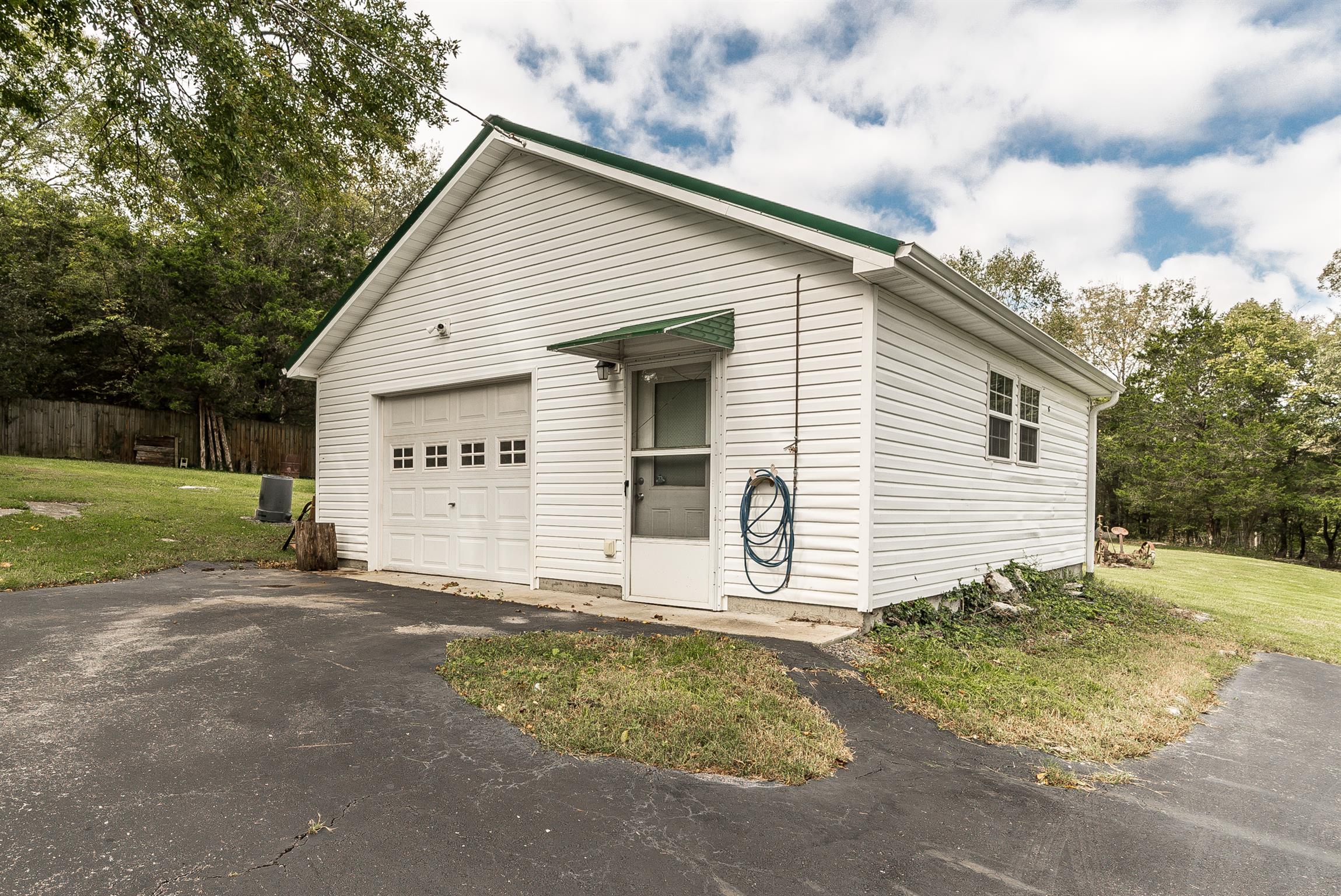 88 Canoe Branch Road Lebanon, TN 37087 - Photo 21 of 30 a view of a house with backyard and trees