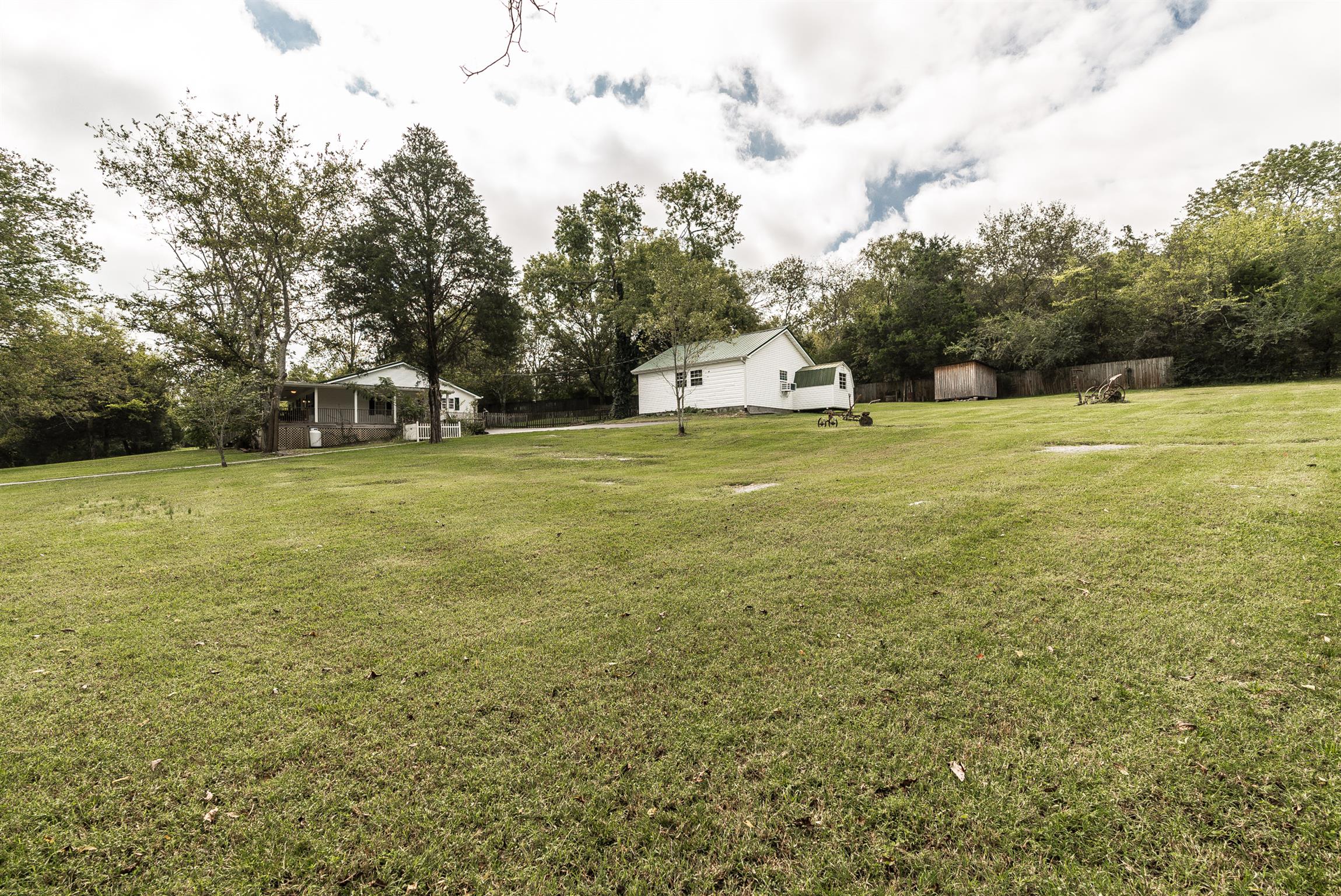 88 Canoe Branch Road Lebanon, TN 37087 - Photo 26 of 30 a view of a big yard with a house and large trees