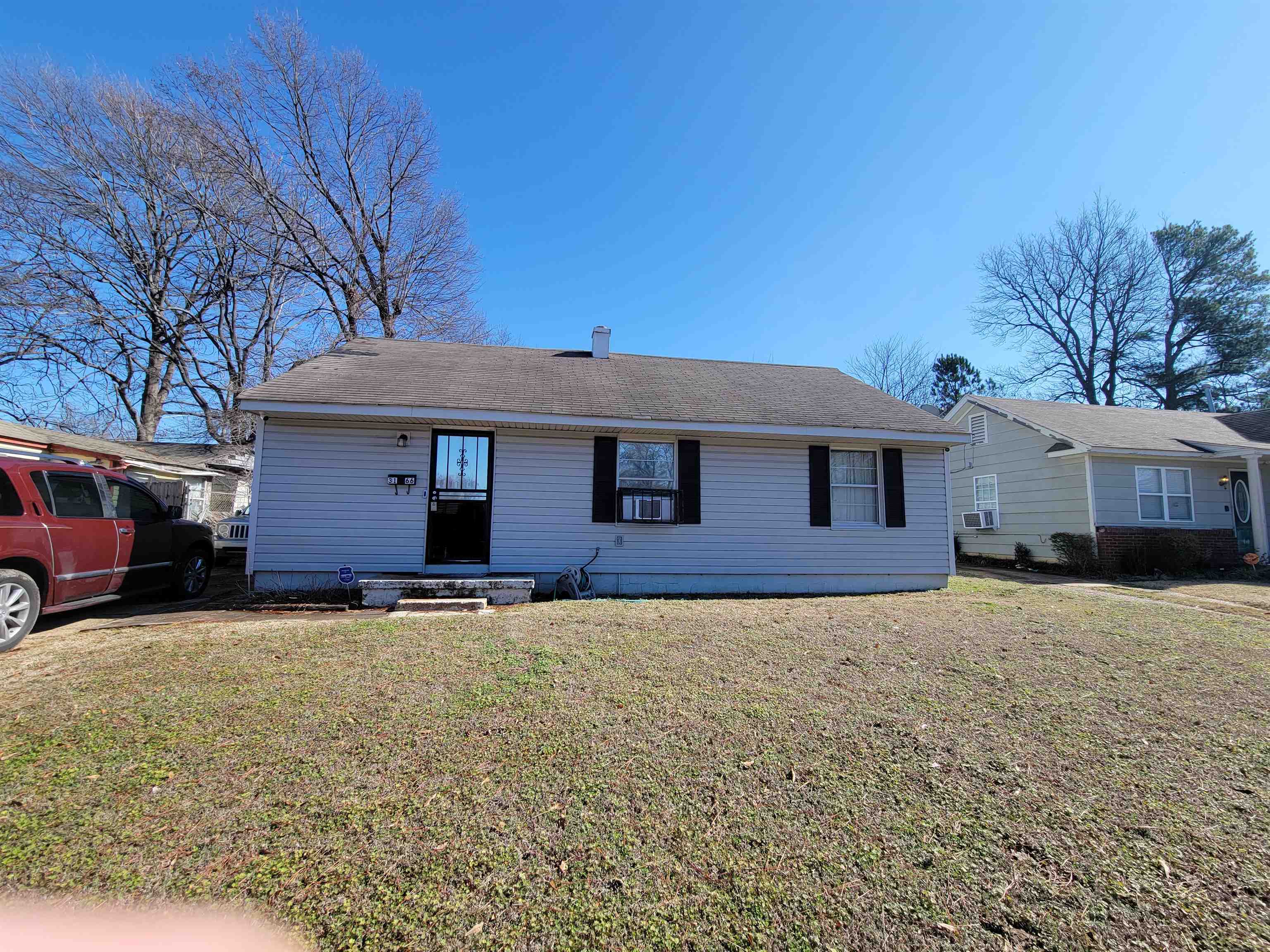 3166 Winslow Road Memphis, TN 38109 - Photo 1 of 12 a front view of a house with a yard