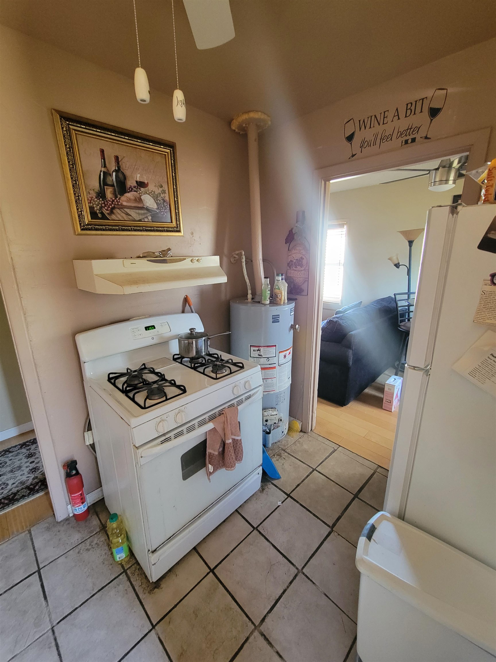 3166 Winslow Road Memphis, TN 38109 - Photo 12 of 12 a kitchen with a stove and a refrigerator