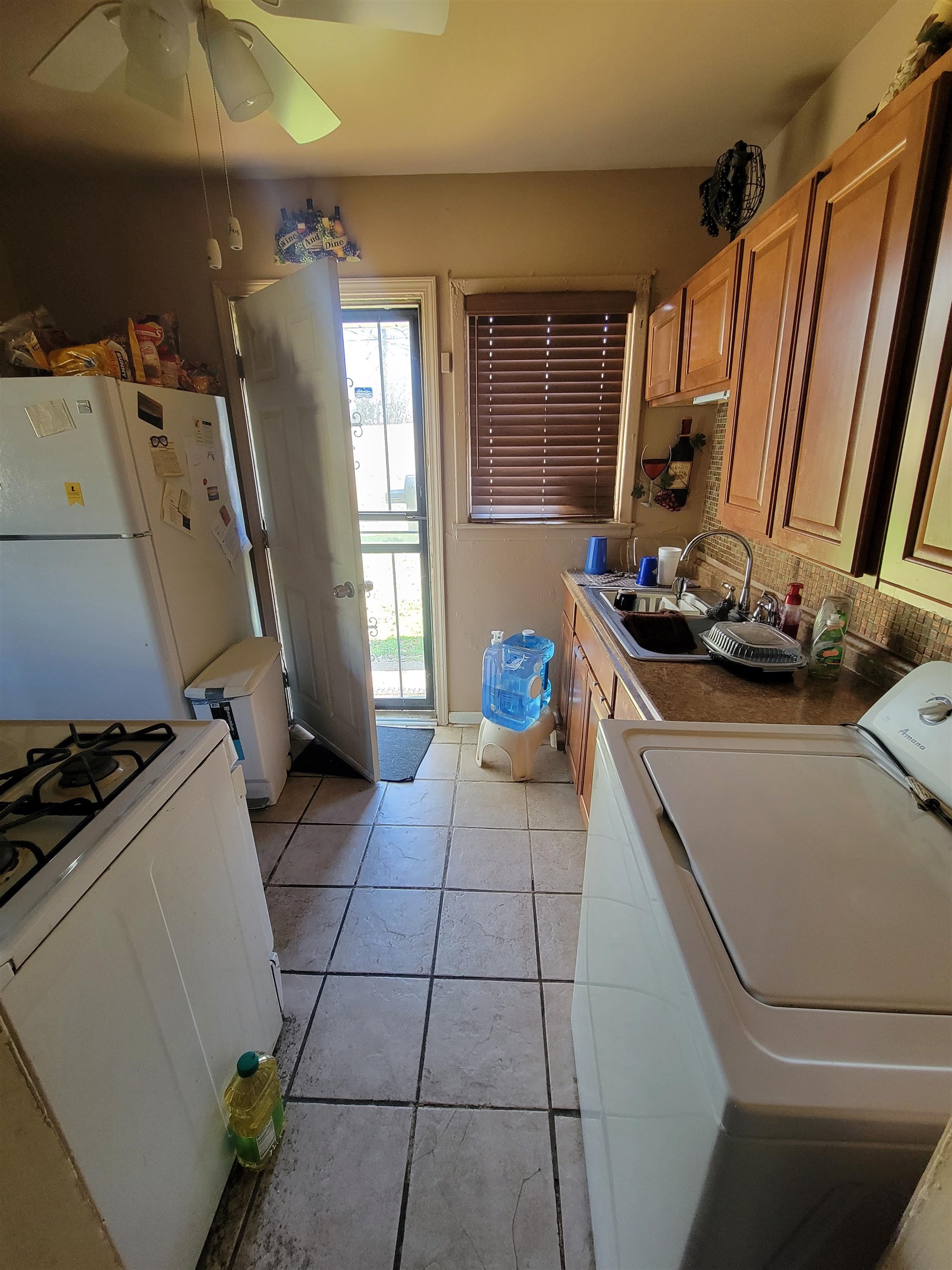 3166 Winslow Road Memphis, TN 38109 - Photo 5 of 12 a kitchen with a sink appliances and cabinets