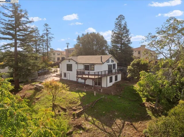a aerial view of a house with a yard