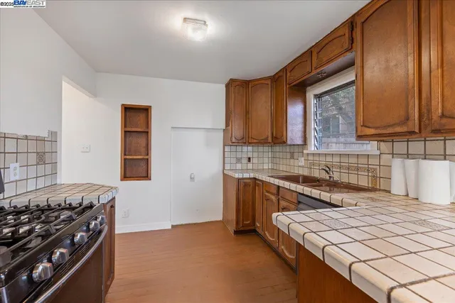 a kitchen with a stove and a sink