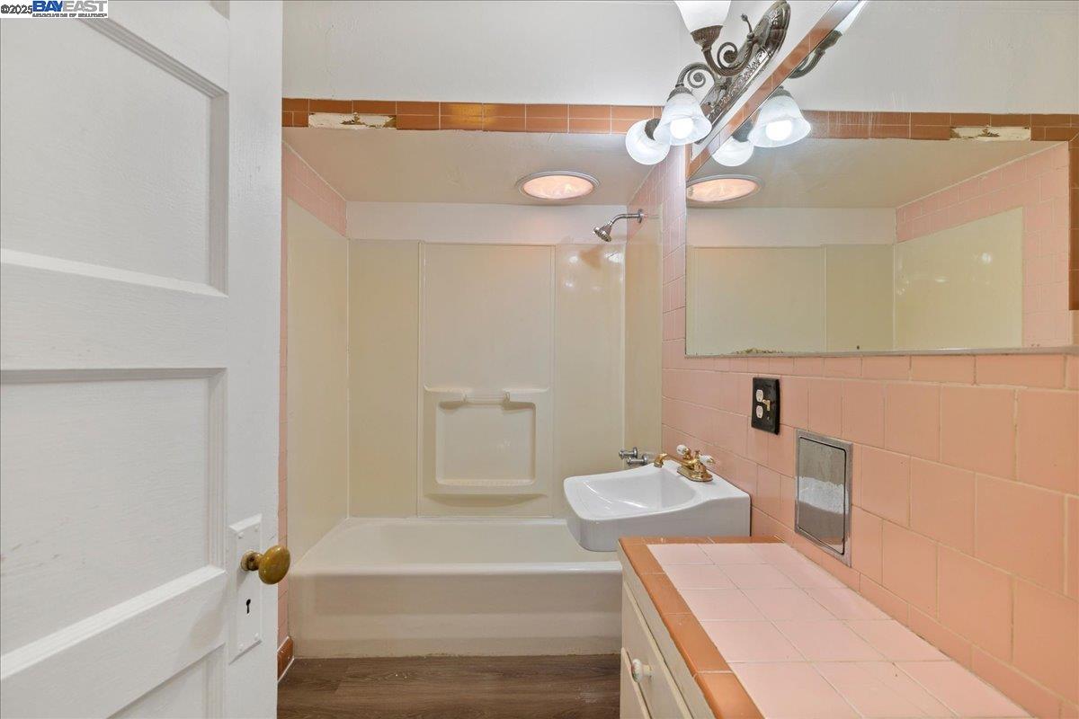 3280 Ohlone Way Hayward, CA 94541 - Photo 23 of 48 a bathroom with a sink a toilet and shower