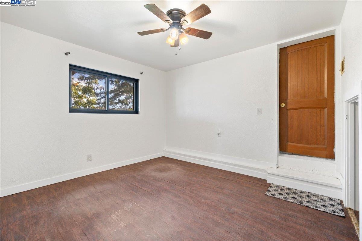 3280 Ohlone Way Hayward, CA 94541 - Photo 28 of 48 an empty room with a window and a ceiling fan
