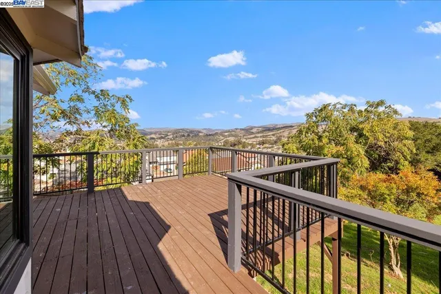 a view of a balcony with wooden floor