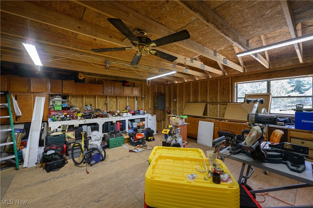 1427 Terrace Road Northwest New Philadelphia, OH 44663 - Photo 15 of 44 Garage featuring a workshop area and ceiling fan