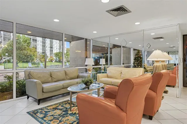 a view of a swimming pool with an outdoor space and seating area