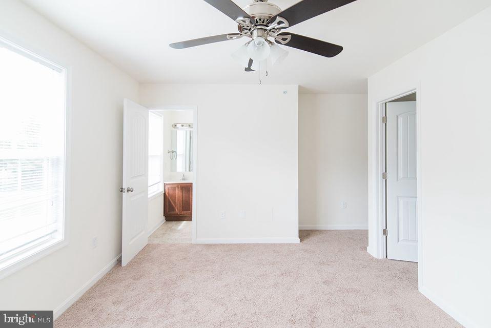 112 Breezewood Drive Hanover, PA 17331 - Photo 8 of 12 a view of a room with a ceiling fan and window