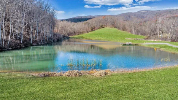a view of a lake with a yard