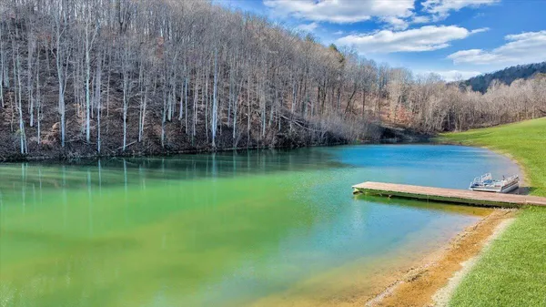 a view of a lake with a big yard