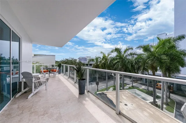 a view of a balcony with chairs