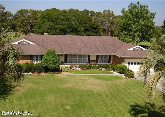 322 Pablo Road Ponte Vedra Beach, FL 32082 - Photo 1 of 19 front view of a house with a yard