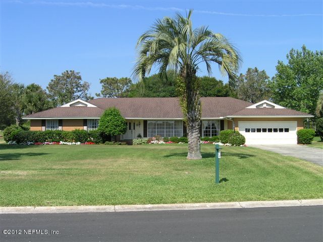 322 Pablo Road Ponte Vedra Beach, FL 32082 - Photo 2 of 19 a front view of a house with a garden