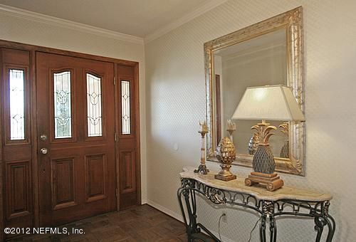 322 Pablo Road Ponte Vedra Beach, FL 32082 - Photo 3 of 19 a balcony with table and chairs