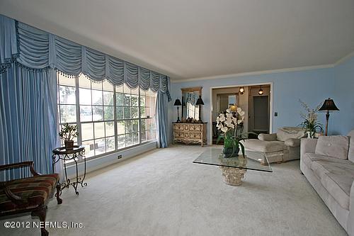322 Pablo Road Ponte Vedra Beach, FL 32082 - Photo 4 of 19 a living room with furniture and a large window