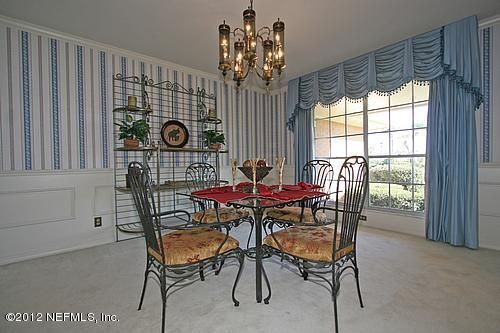 322 Pablo Road Ponte Vedra Beach, FL 32082 - Photo 6 of 19 a view of a dining room with furniture and window